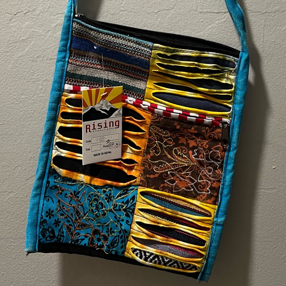Boho Crossbody purse in Blue trim NWT Adjustable strap. From Naples Boutique
